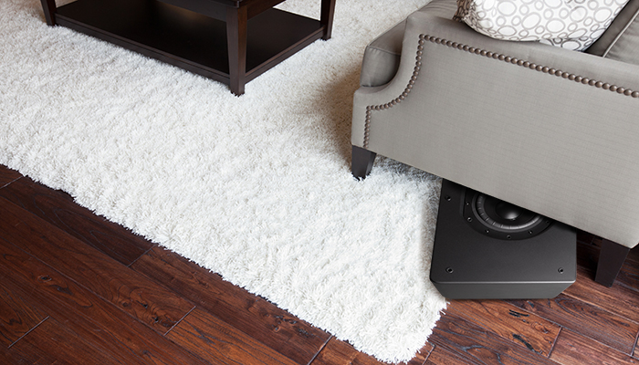 PULSE-SUB-Subwoofer-peaking-out-from-under-sofa5ccb63f2cb32f